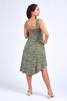 Woman wearing green print dress.