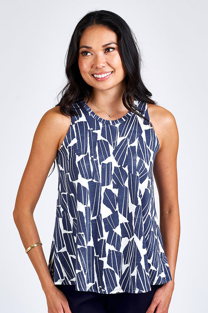 Woman wearing blue and white tank top.