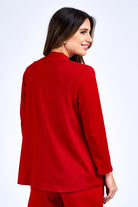 Woman wearing red jacket.