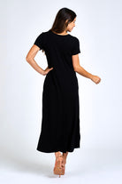 Woman wearing black maxi dress.